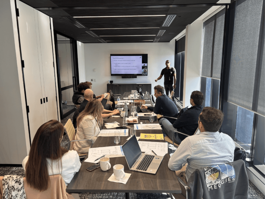 Business leaders participating in a practical AI education and advisory workshop